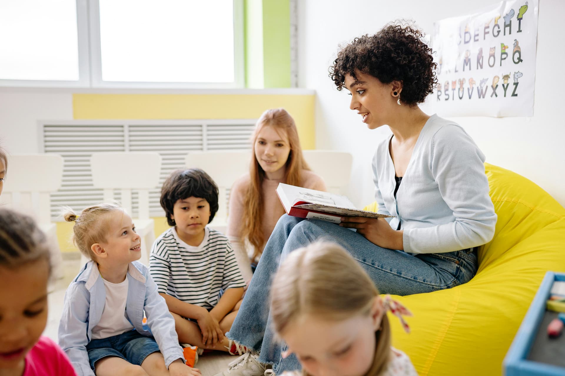 Caregiver building bonds with children at Bright Beginnings